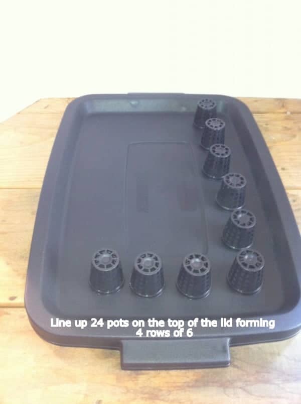 Line up 24 pots on the top of the lid forming 4 rows of 6